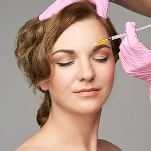 Botox being applied to woman's eyebrows